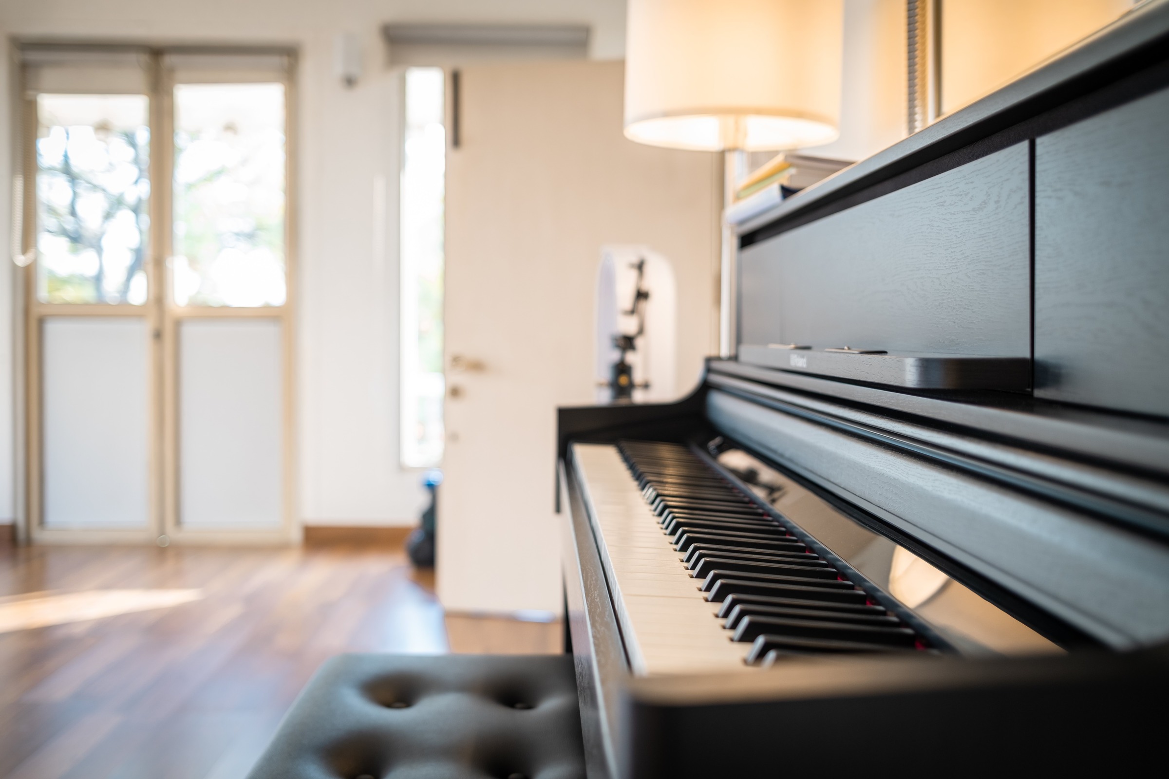Bright piano room inside The Music Atelier